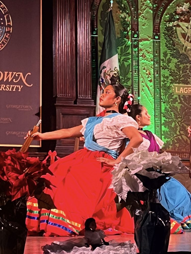 Young woman in traditional dress dancing