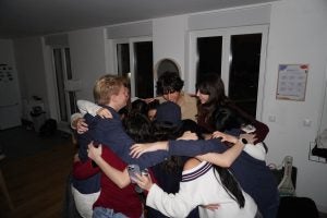 A group of students huddling