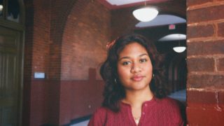 Young woman in red shirt