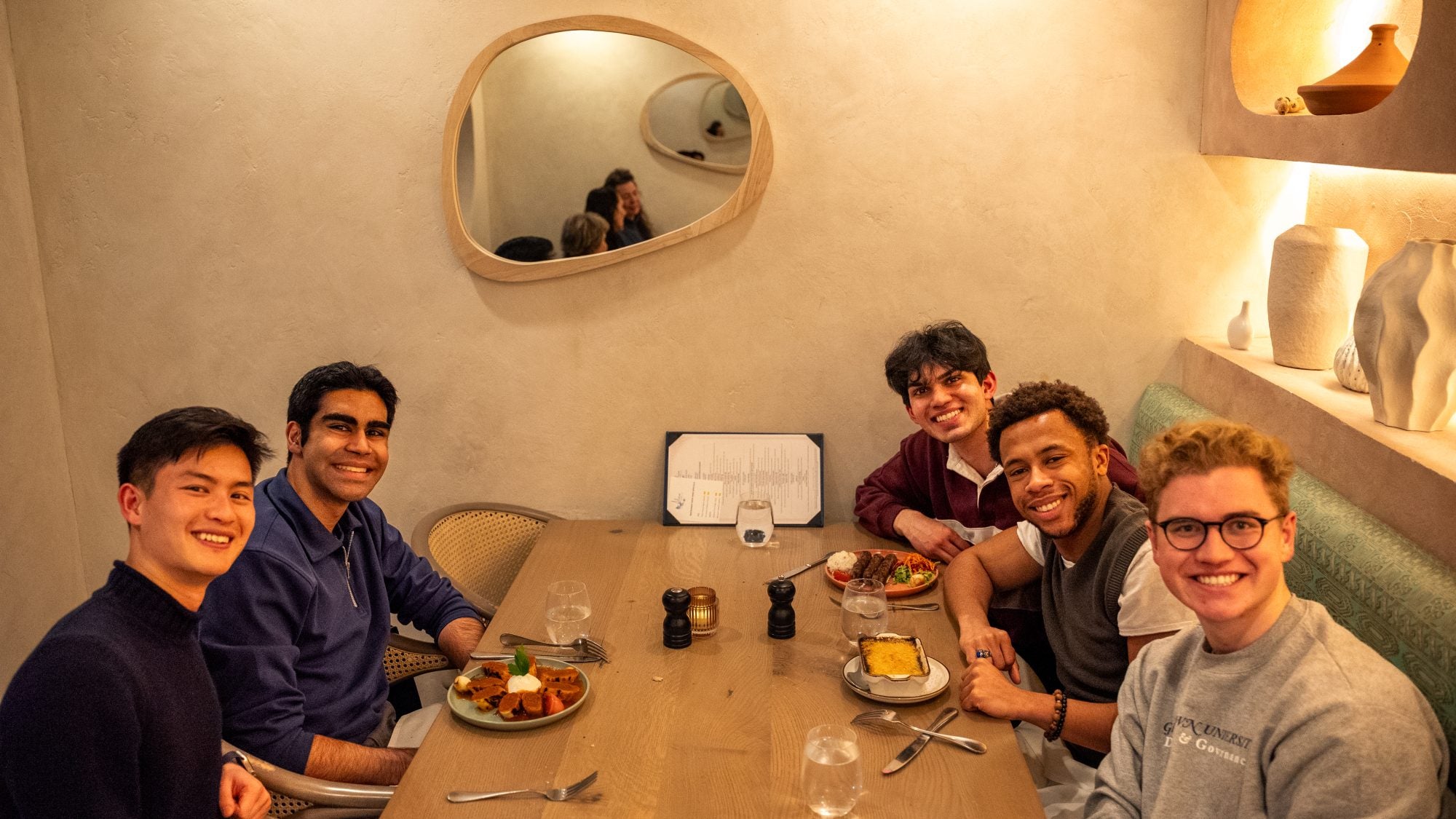 Five young men at a restaurant