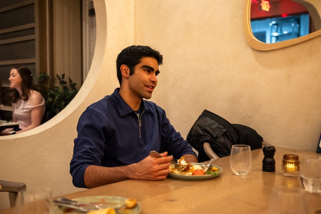 Young man with a plate of food
