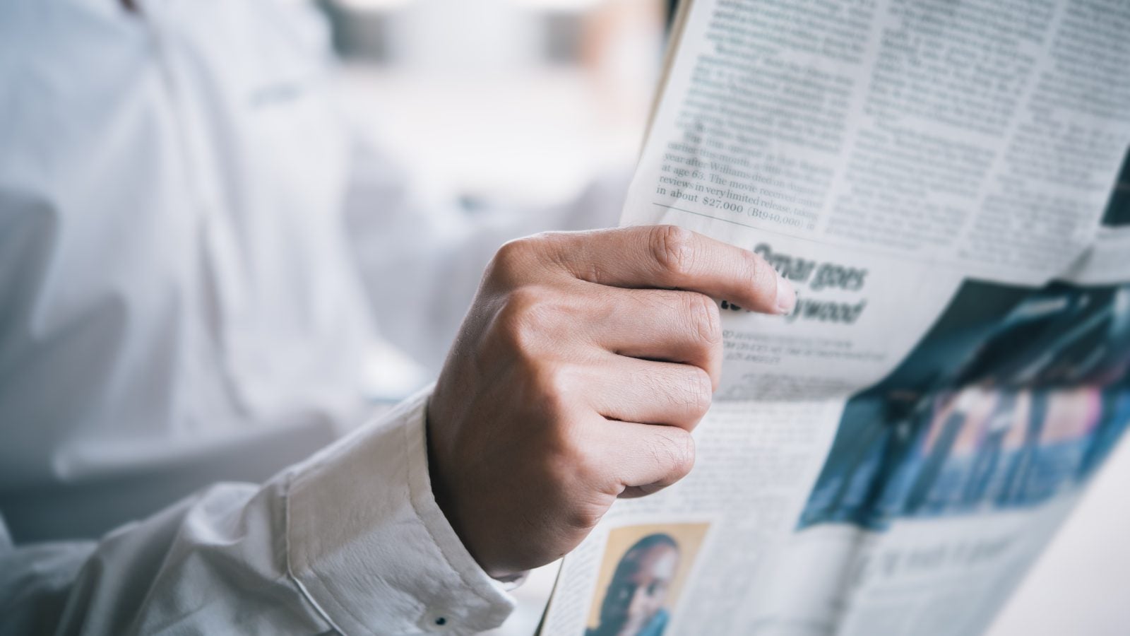 Midsection Of Businessman Reading Newspaper