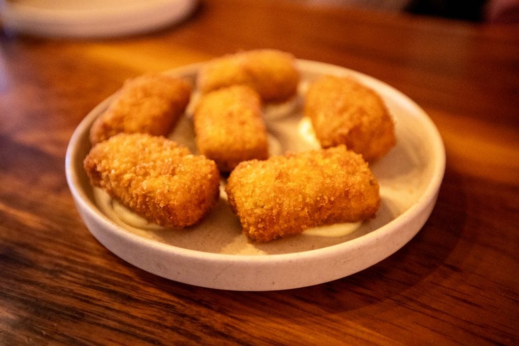 A plate of deep fried appetizers