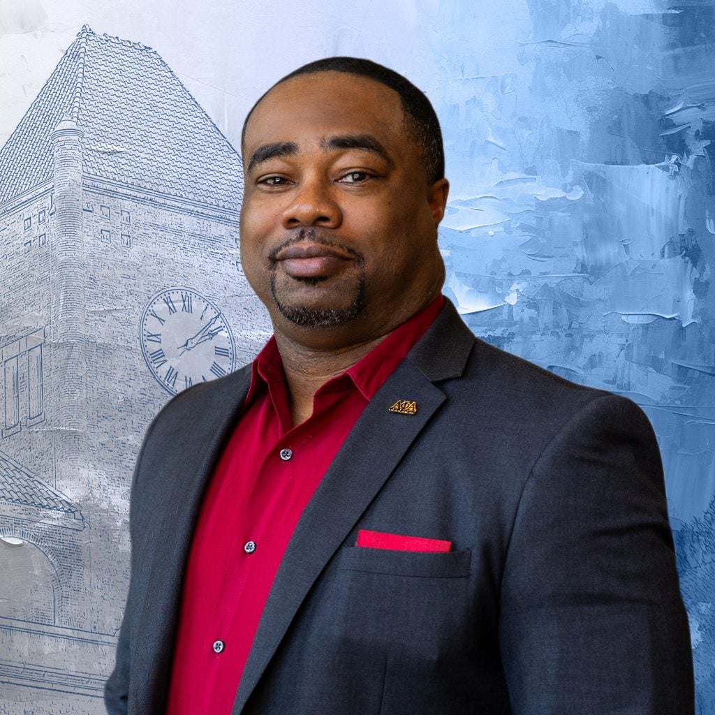 Black man in suit with red shirt