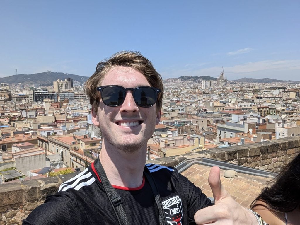 Young man in sunglasses overlooking Barcelona