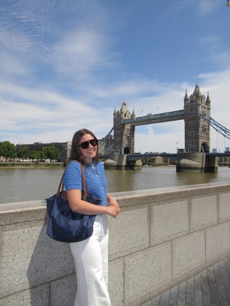 Young woman in a blue blouse in London on a sunny day