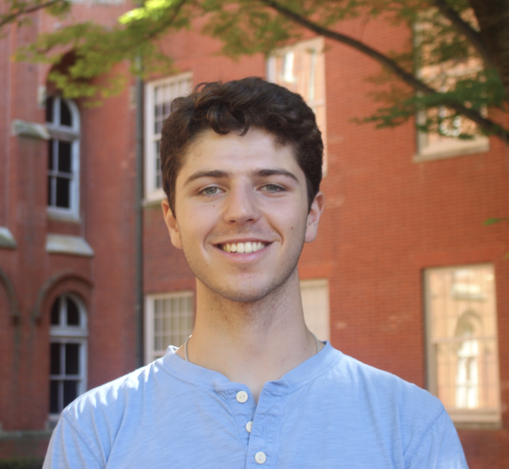 Caucasian man in a blue shirt headshot
