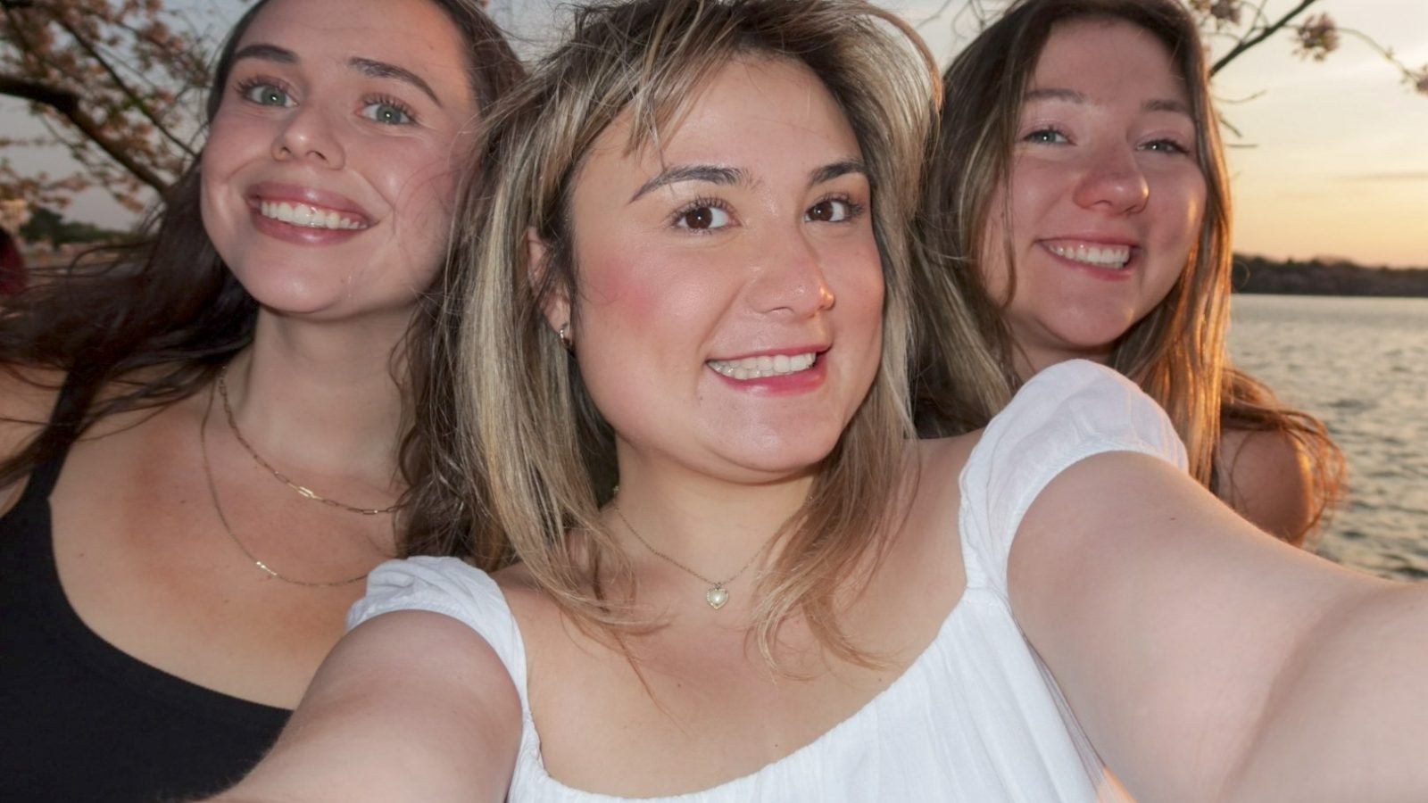 Three young women at the cherry blossoms