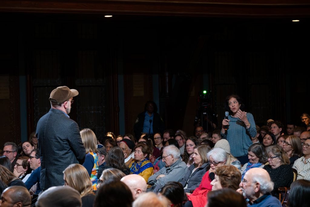 Female audience member speaks during reflection session