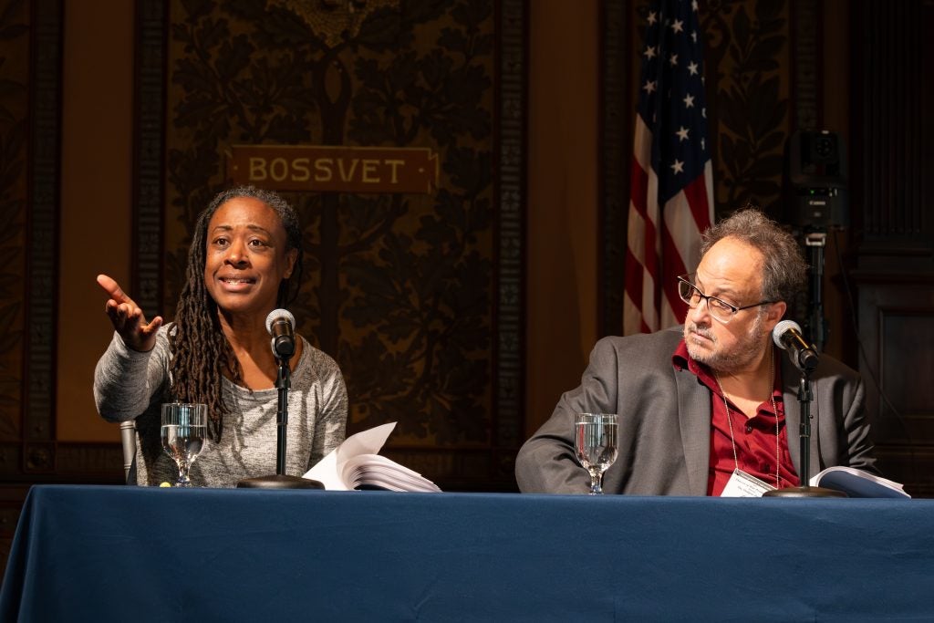 Black woman points from stage during a performance