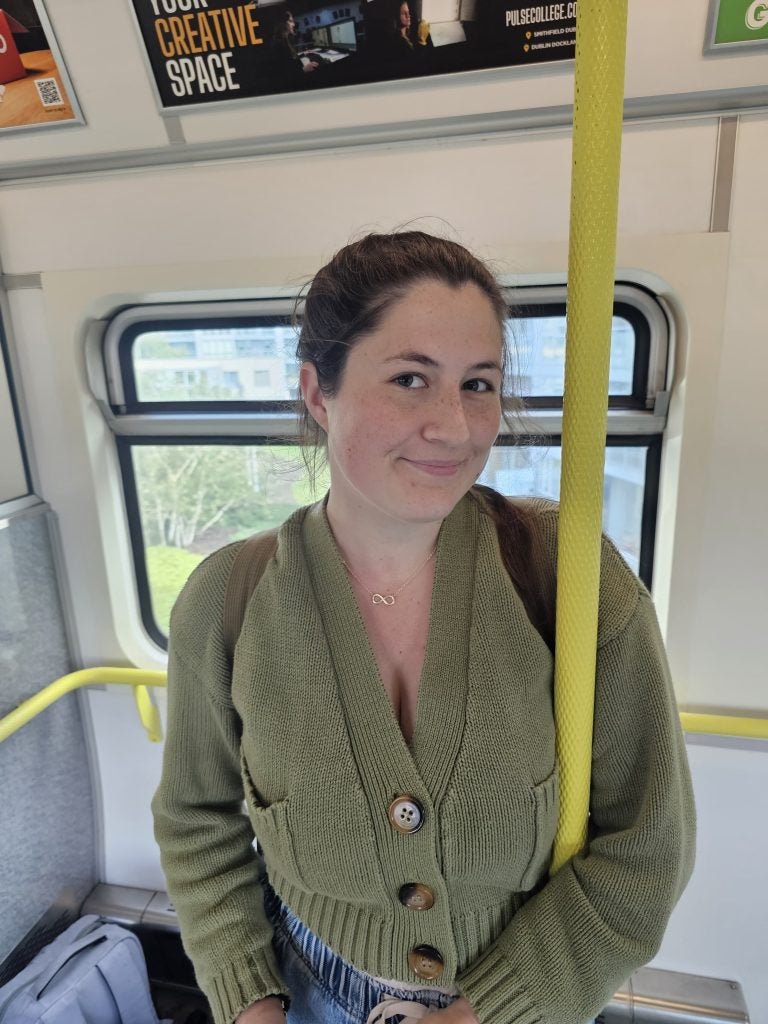 young Caucasian woman on public transportation