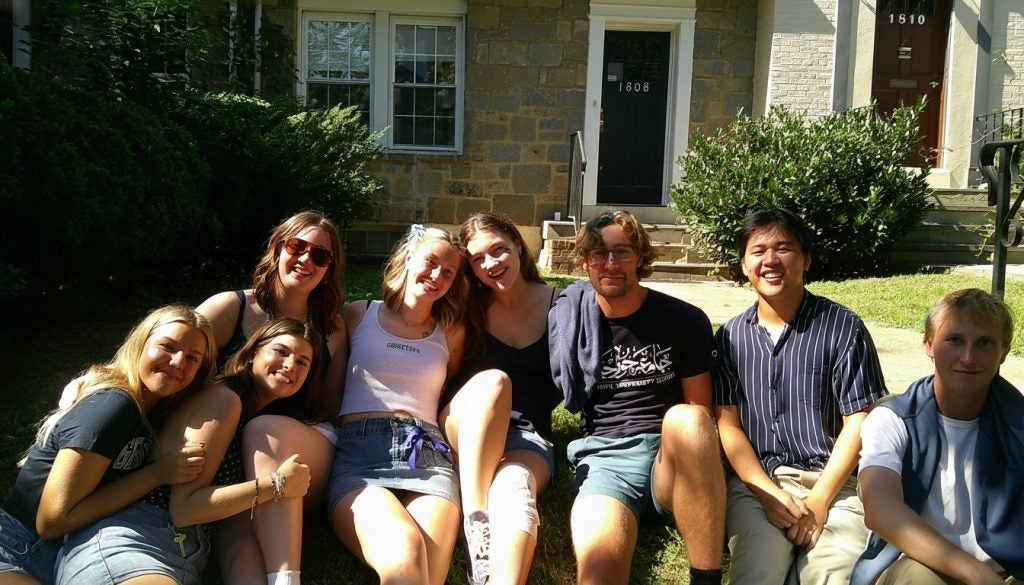 A group of college students outside on a sunny day