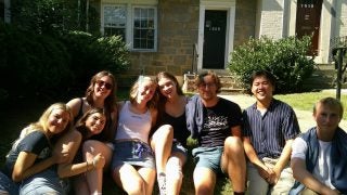 A group of college students outside on a sunny day