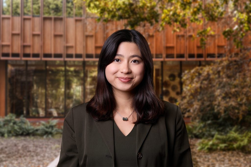 Young Asian woman smiling in business attire