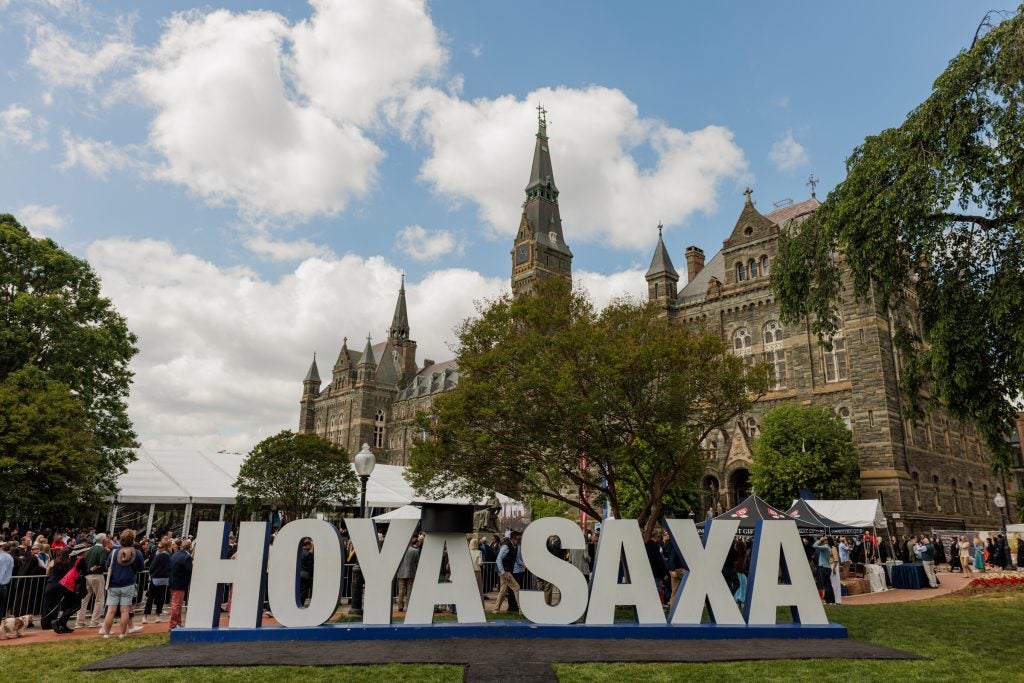 A sign that says "Hoya Saxa" on Georgetown's campus