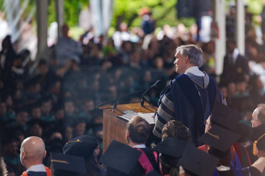 Interim President Robert Groves addresses a crowd of students