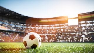 A close-up of a soccer ball in a stadium
