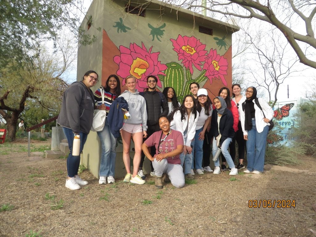 Group of college students smiling for photo
