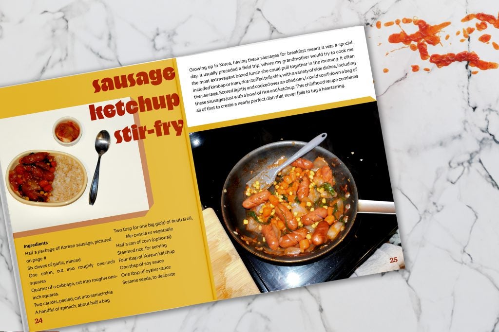 High-top view of cooking photo. Magazine spread open on counter. Ketchup splashed on the side.