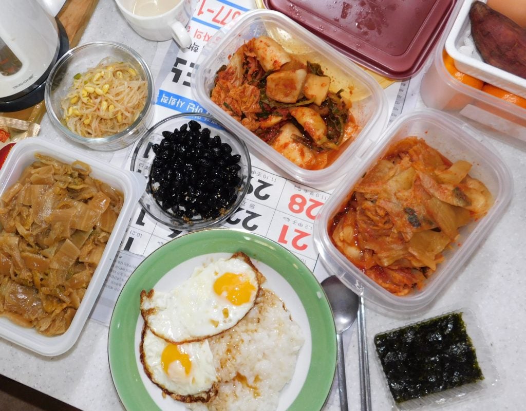 A table filled with different Korean dishes