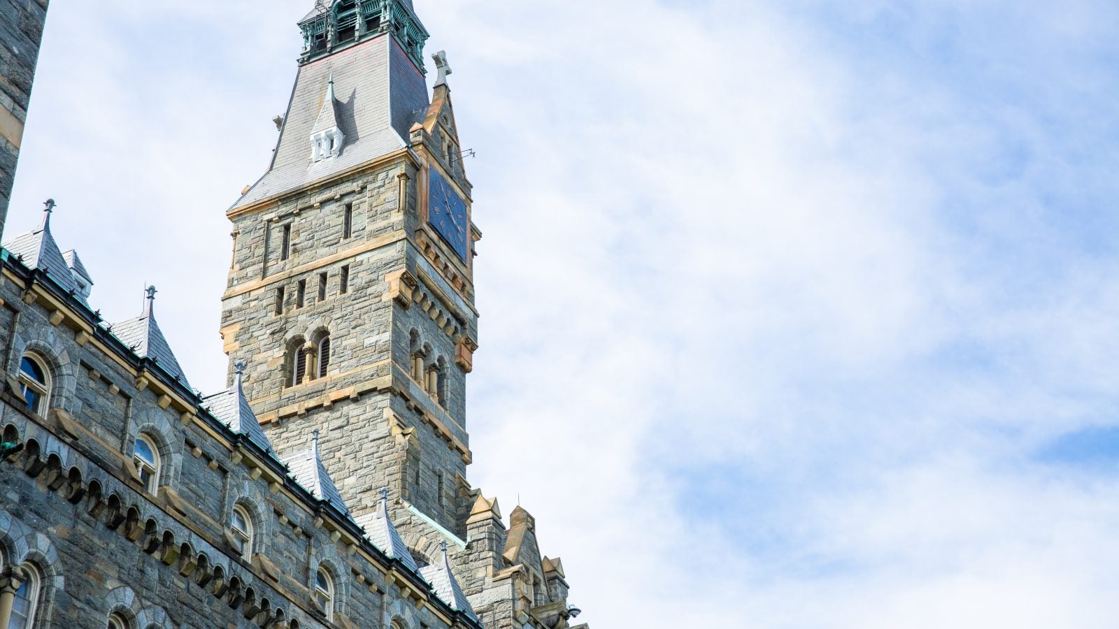 Healy Hall on a sunny day with some clouds