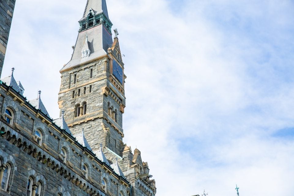 Healy Hall on a sunny day with some clouds