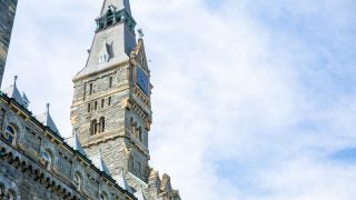 Healy Hall on a sunny day with some clouds
