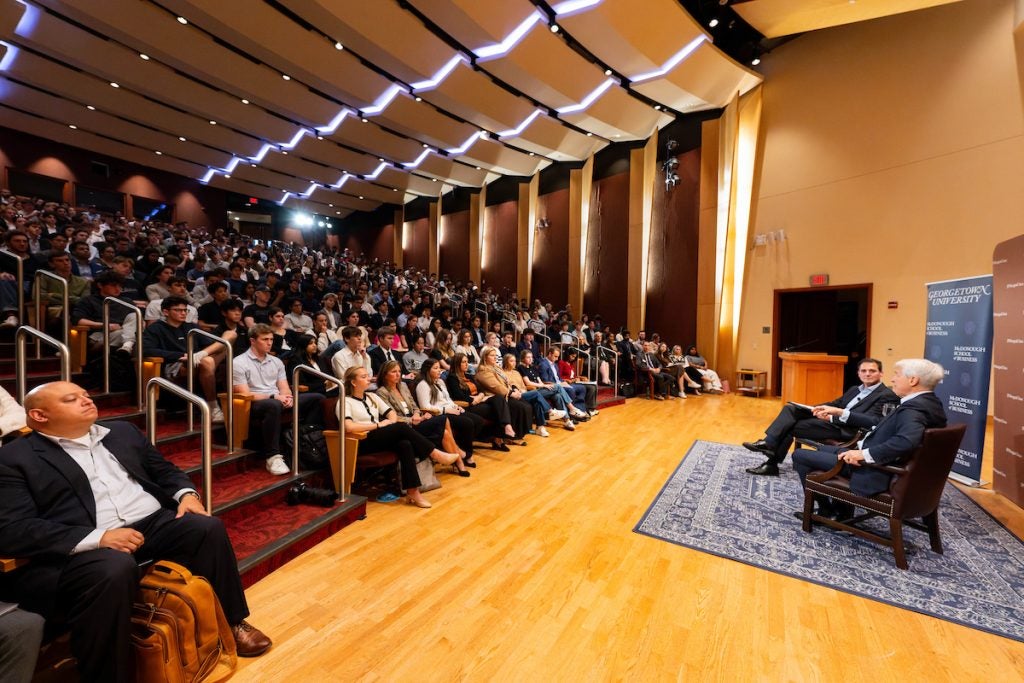 A packed auditorium for a panel event