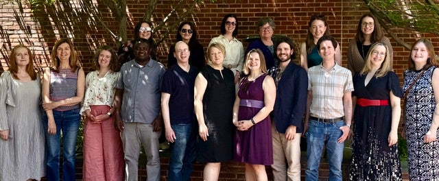 Faculty members at a celebration outdoors