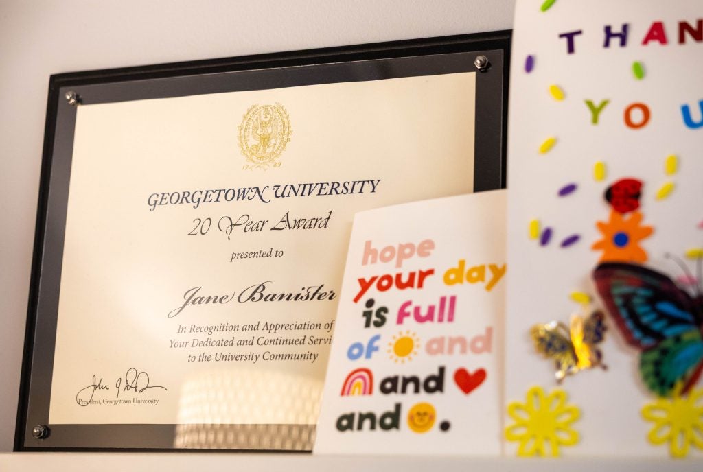 A framed award and colorful cards 