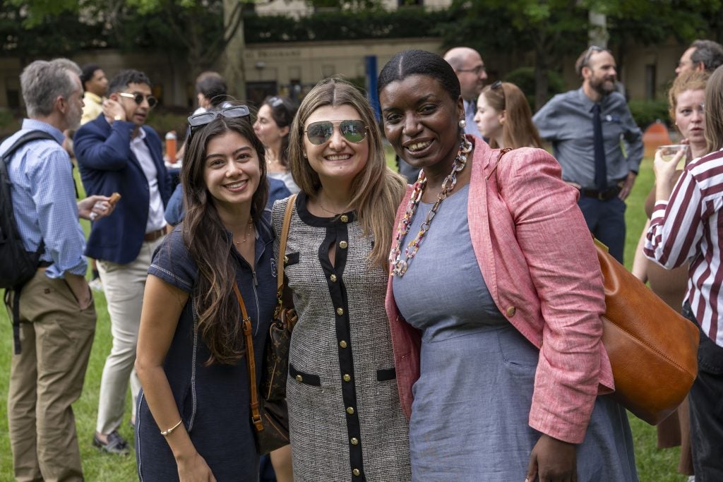 Three young women smiling
