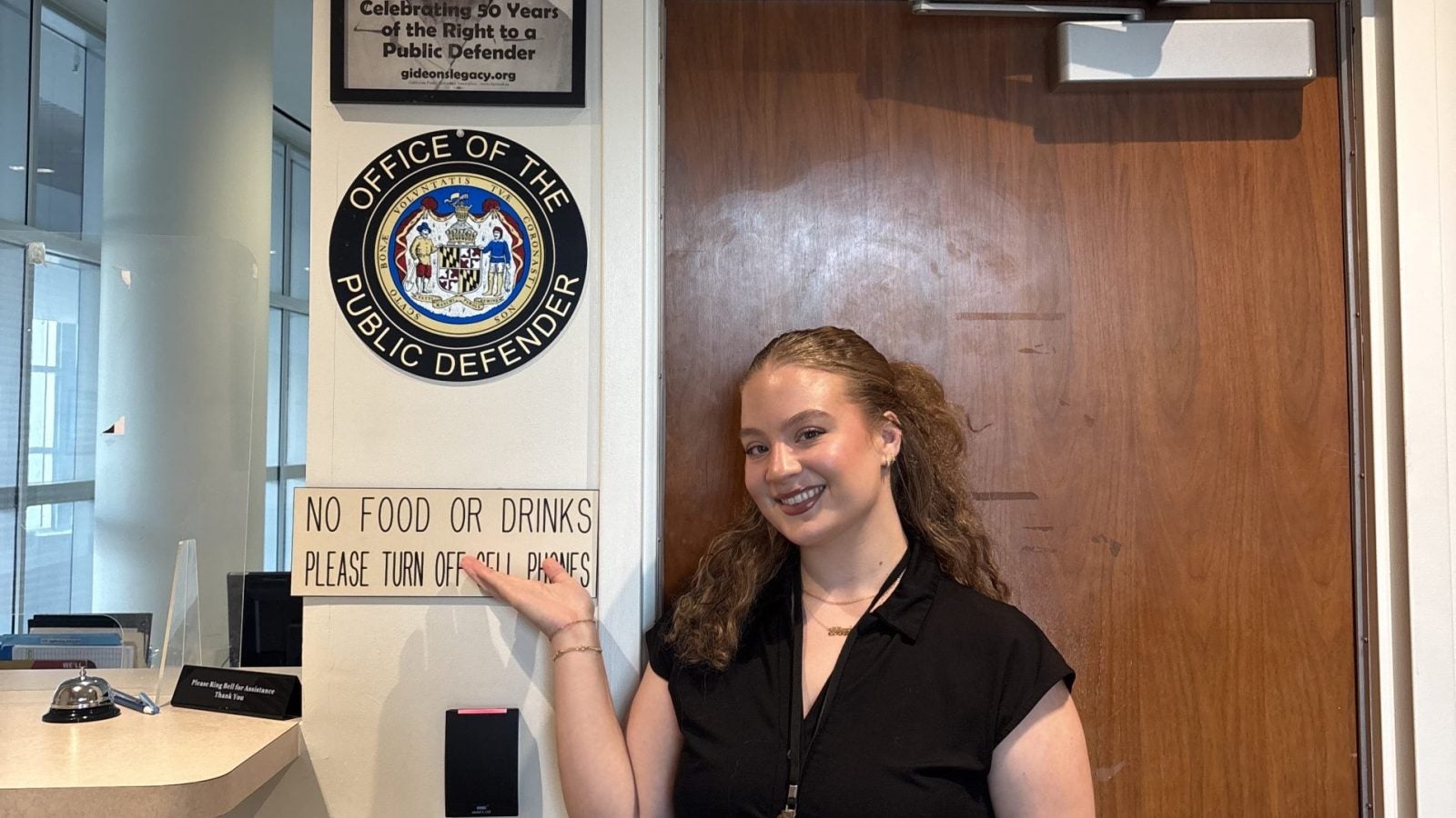 A student poses outside the Maryland Public Defender's Office