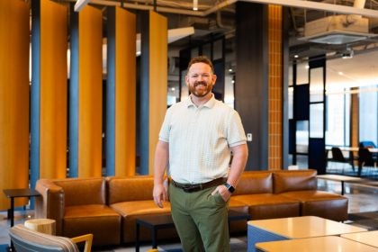 Man smiling inside a lobby