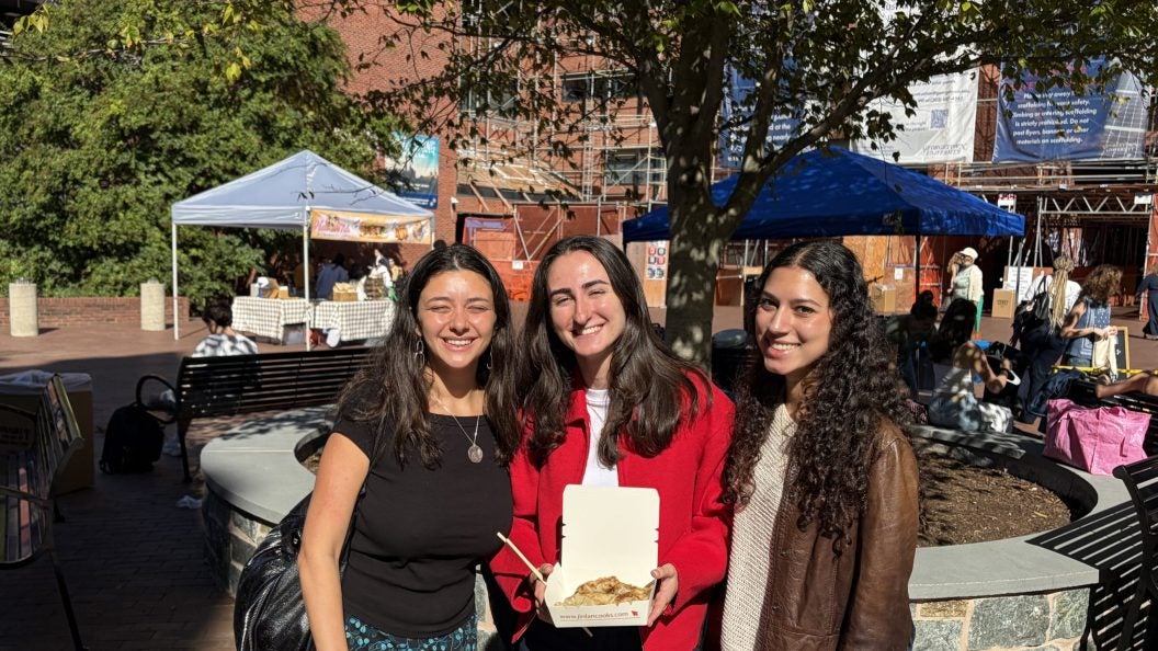 Three young women at the GU farmers market