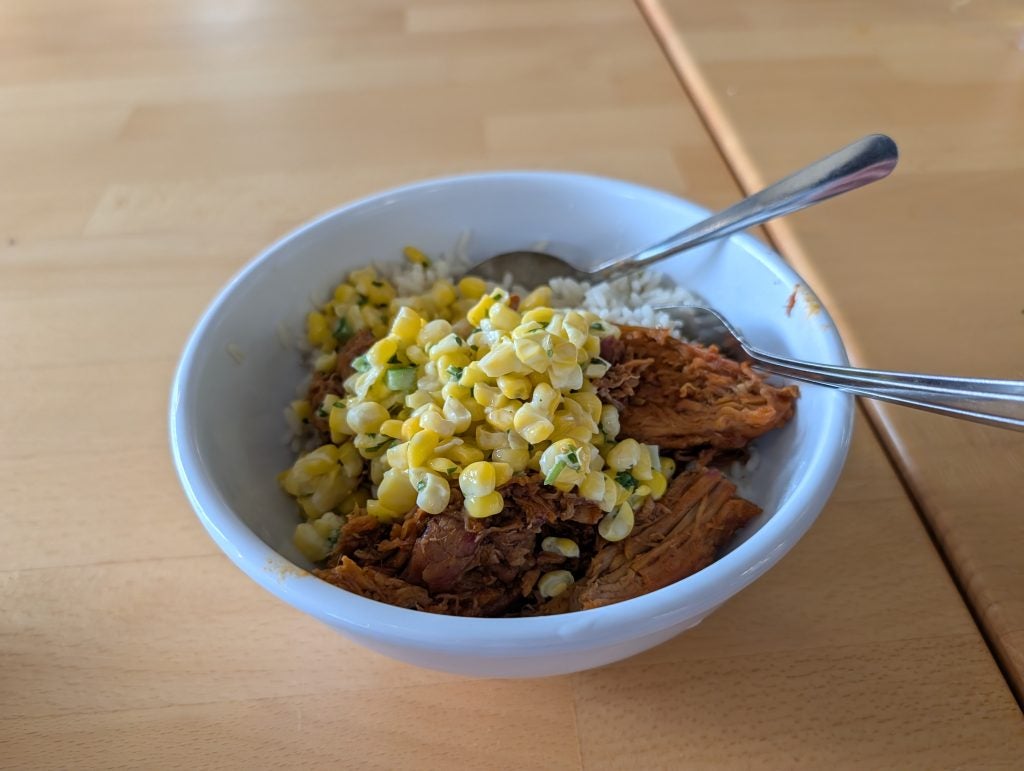 A plate with chicken and corn