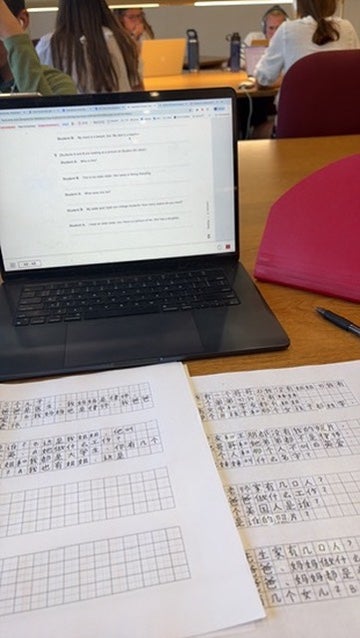 A laptop and some Chinese language worksheets