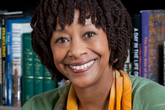 Gay McDougall smiles at the camera in a headshot.