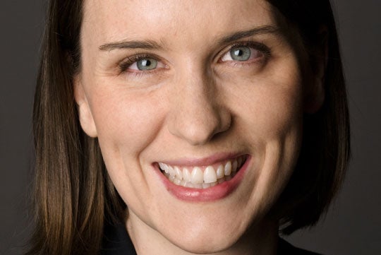 Helen O'Reilly smiles for the camera in a headshot.