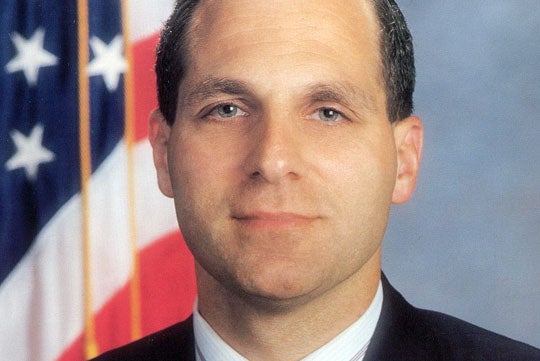 Louis J. Freeh smiles for the camera in a headshot.