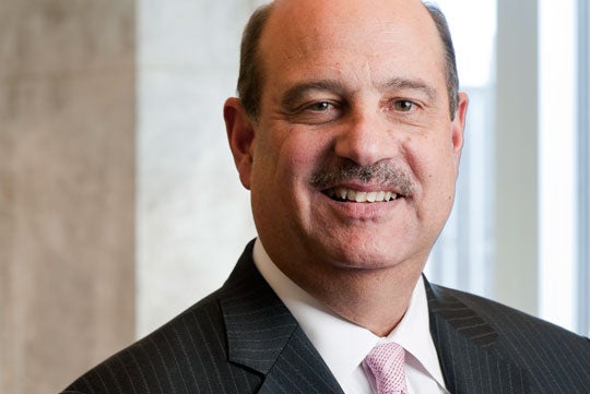 Barry Salzberg smiles in a headshot. 