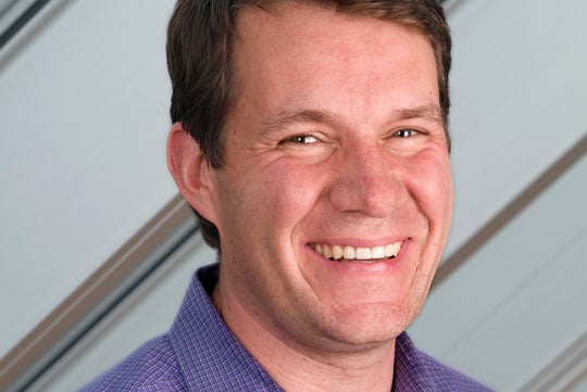 Scott Case smiles in a headshot. 