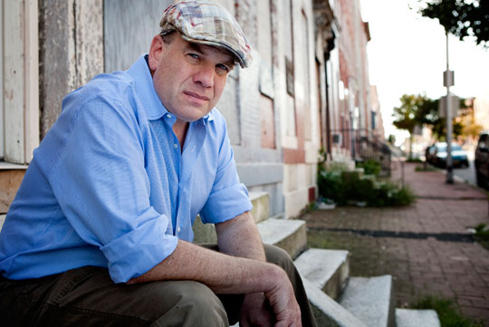 David Simon looks at the camera in an official photo. 
