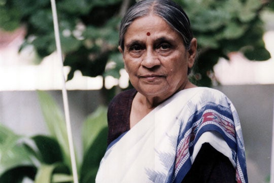 Ela R. Bhatt looks at the camera in a headshot. 