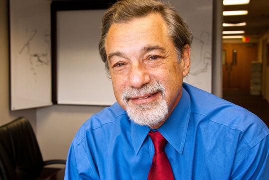 Dr. Michael Zasloff smiles in a headshot.