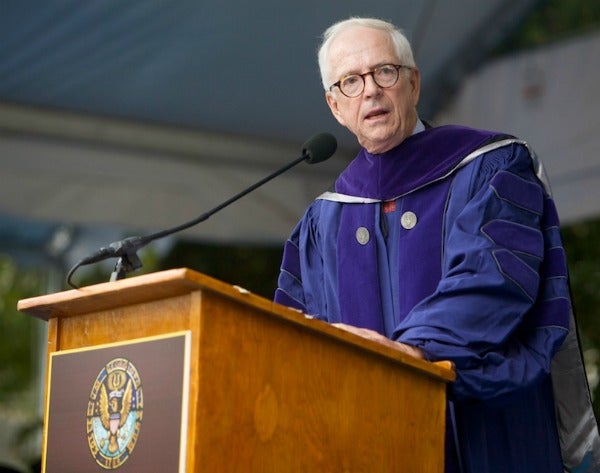 Brendan V. Sullivan Jr. looks out to the left while speaking behind a podium