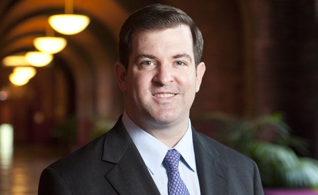 Michael Barry smiles in a headshot.