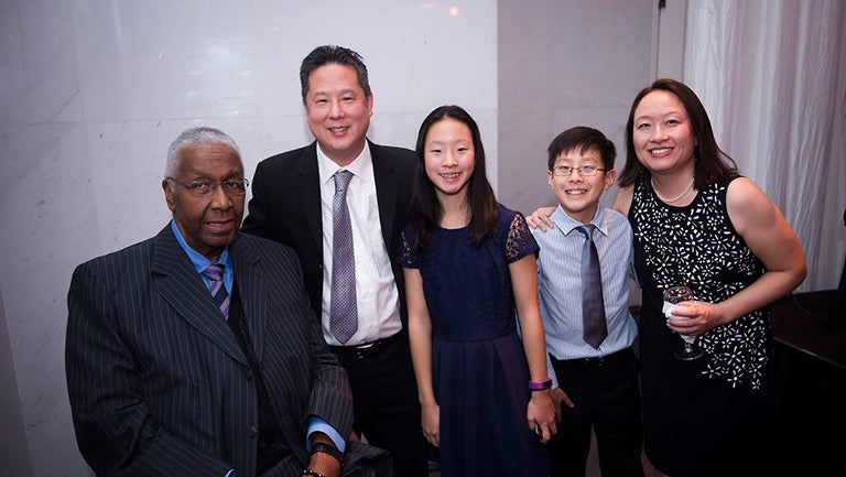 John Thompson jr sitting along with standing Steve Park his wife Mary and their children at the Kennedy Center 