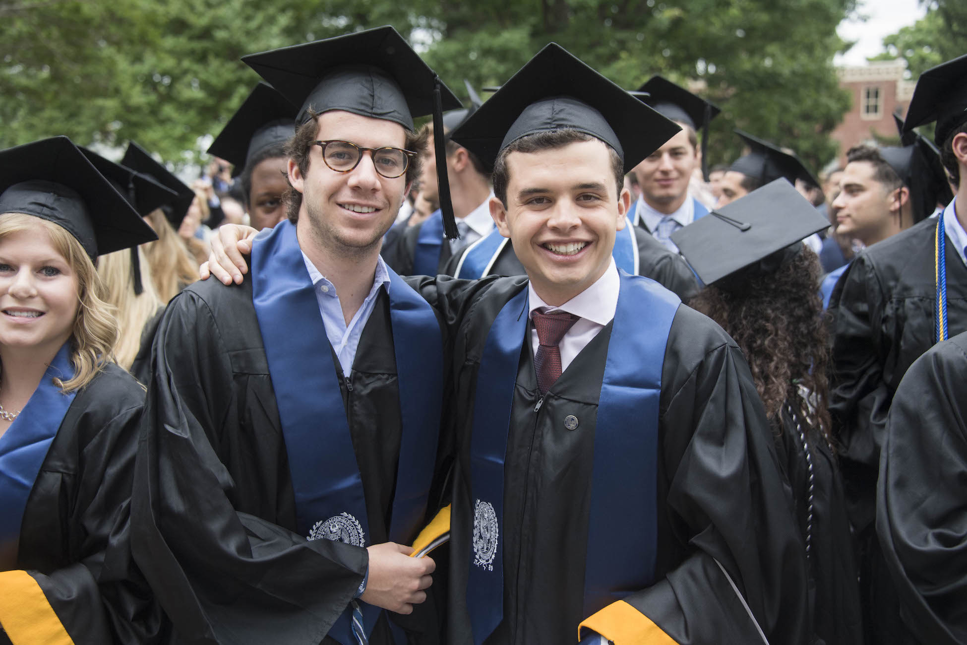 Two MSB graduates smiling
