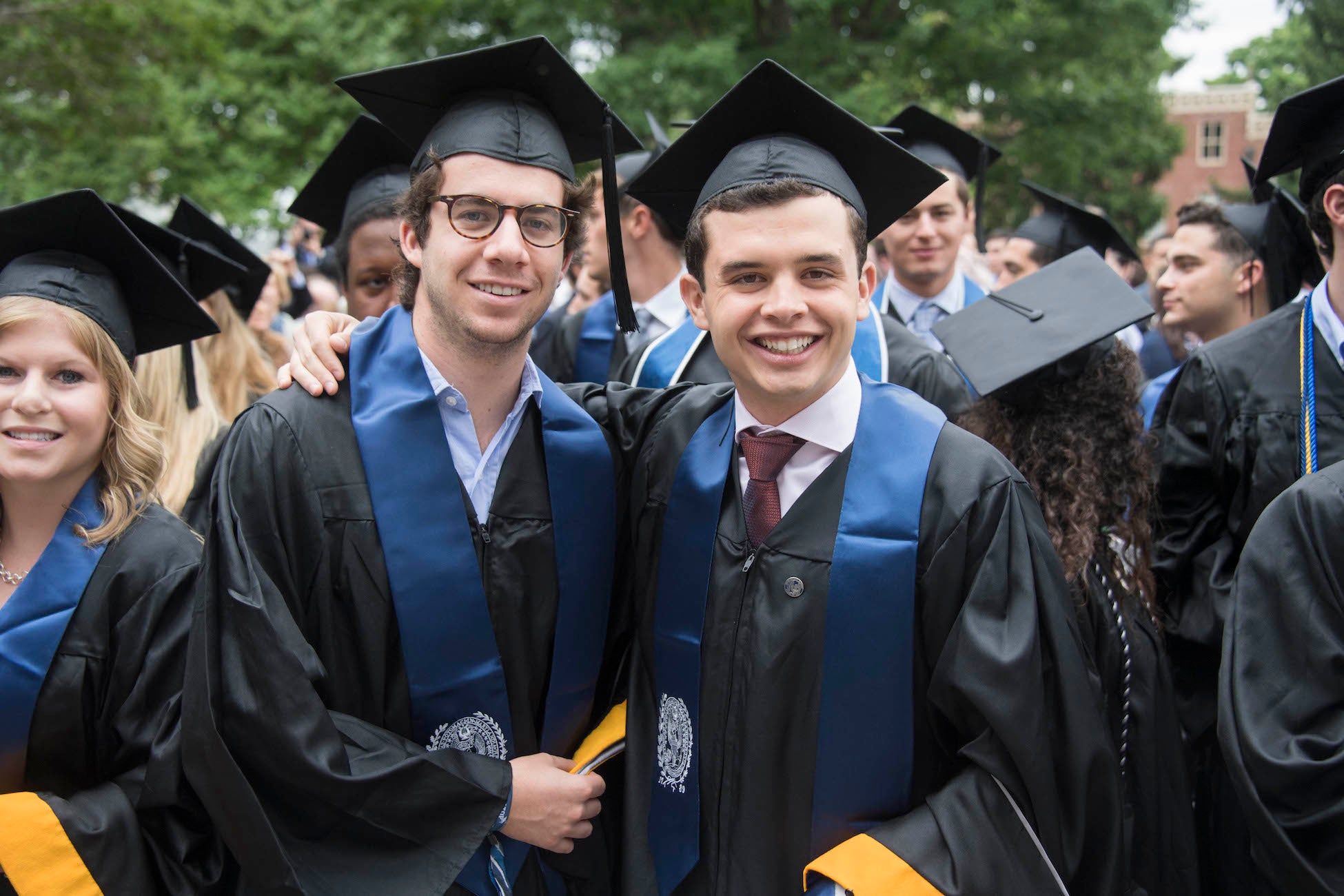 Two MSB graduates smiling