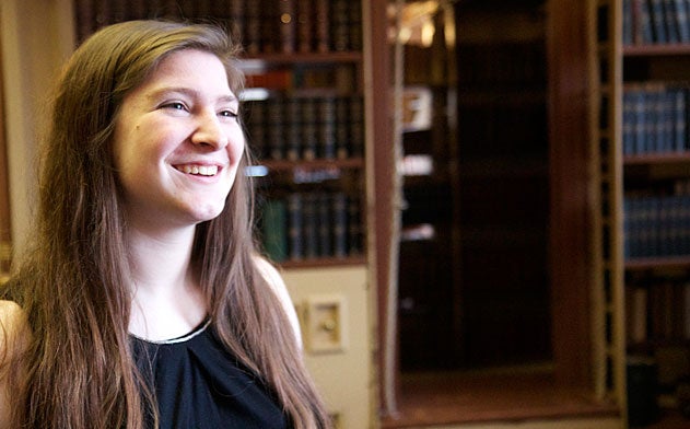 Heather Artinian sits in Riggs Library